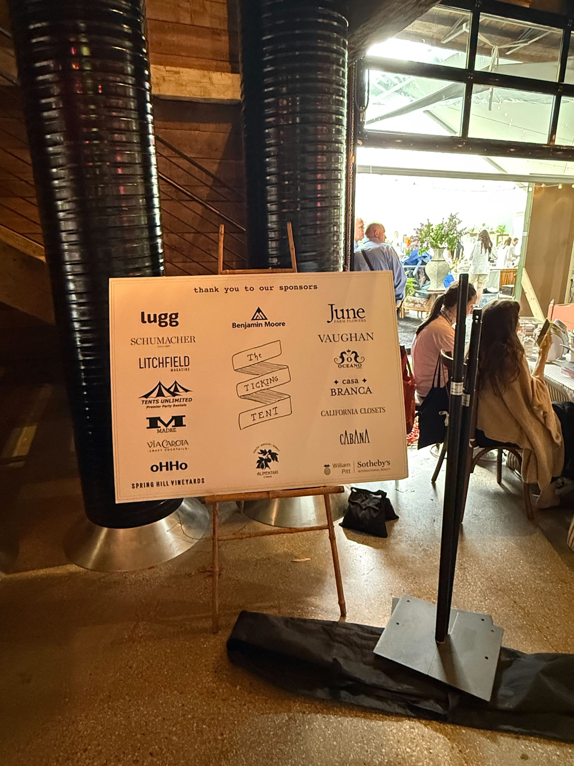 Thank you to our sponsors sign inside The Ticking Tent, featuring Lugg and other event partners at Spring Hill Vineyards.