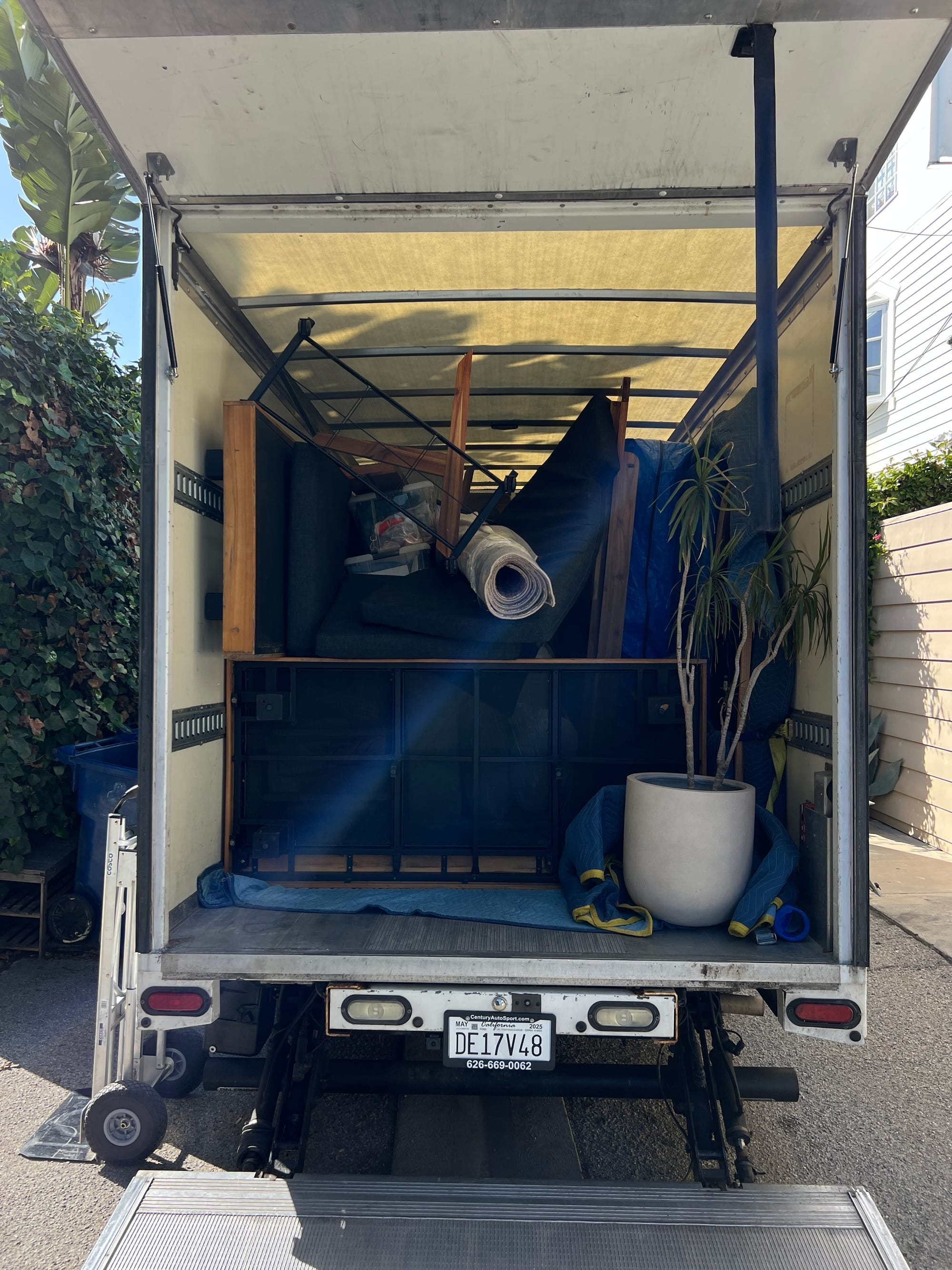 A Lugg Box truck fully packed with boxes, equipment, and wrapped furniture, showing truck capacity for apartment and multi-item moves.