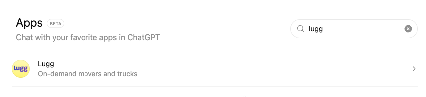 ChatGPT Apps page in beta showing 'Chat with your favorite apps in ChatGPT' heading, with 'lugg' typed in the search bar and Lugg appearing in results with its purple logo and description 'On-demand movers and trucks'