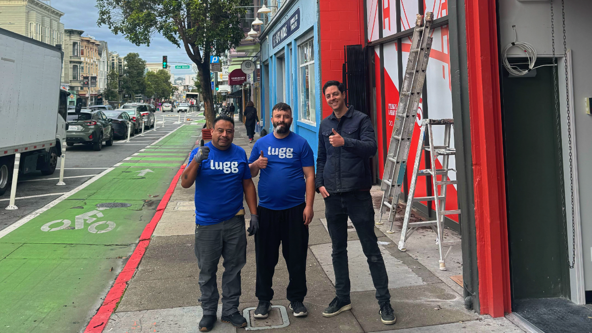 Lugg movers and The New Wheel founder Brett Thurber standing outside the new bike shop at 1031 Valencia Street, San Francisco